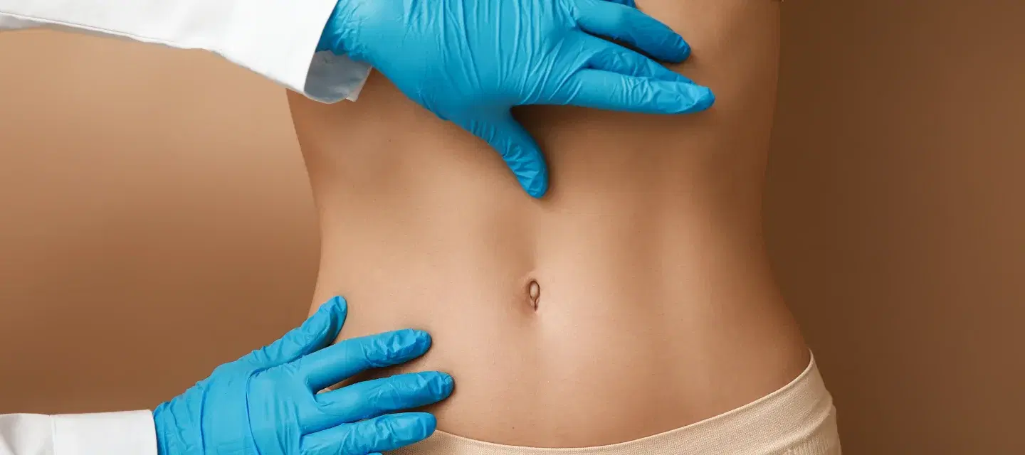 How does a tummy tuck change belly button anatomy?